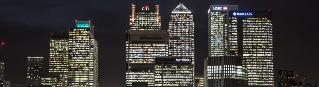 Business buildings in Canary Wharf lit up at night